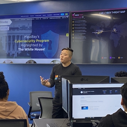 Instructor teaching students in the MassBay Cyber Range